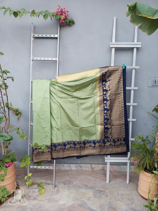 Banarasi Soft Silk Plain Saree In Pastel Green Body And With Antique Zari Mor Motifs On Border And Anchal In Peacock Blue Base