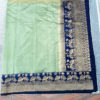 Banarasi Soft Silk Plain Saree In Pastel Green Body And With Antique Zari Mor Motifs On Border And Anchal In Peacock Blue Base