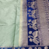 Banarasi Soft Silk Plain Saree In Pastel Green Body And With Antique Zari Mor Motifs On Border And Anchal In Peacock Blue Base