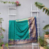 Banarasi Soft Silk Plain Saree In Turquoise Green With Antique Zari Mor Motifs On Border And Anchal In Peacock Blue