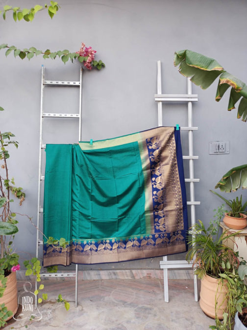 Banarasi Soft Silk Plain Saree In Turquoise Green With Antique Zari Mor Motifs On Border And Anchal In Peacock Blue