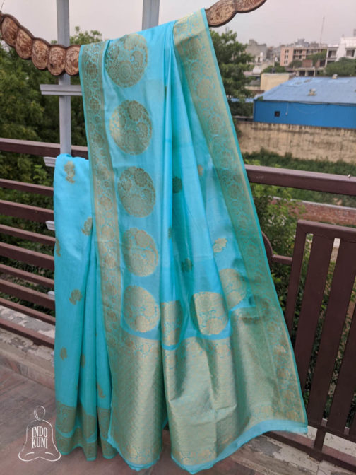 Banarasi Soft Silk Sky Blue Saree With Floral Boota All Over In Bright Golden Zari