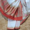Banarasi Soft Silk In White With Big Circular Zari Boota And Resham Meenakari Floral And Mor Figure Work And Red Border