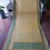 Banarasi Soft Silk In Off-white and Green with Golden Zari Floral Boota All Over And Zari & Brocade Work On Border