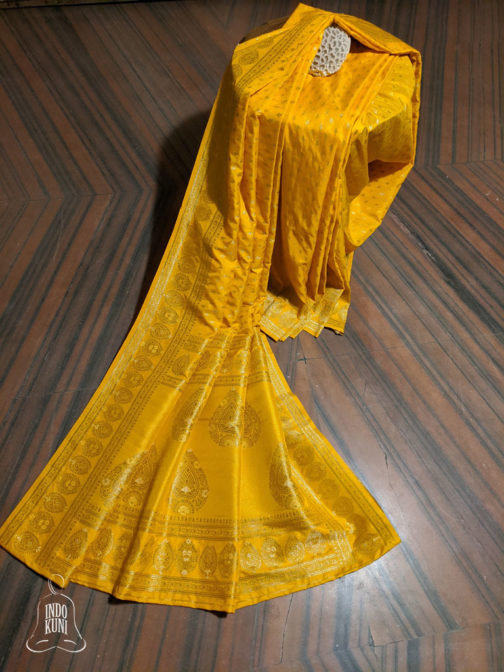 Banarasi Soft Silk Ochre Yellow Small Boota All Over With Circular Boota Border And Paisley Weave Anchal In Bright Golden Zari Weave