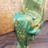 Banarasi Chinia Silk Pastel Green Saree With Orange Green Purple Resham flower motif And Zari Rose Boota Jangla Weave With Meenakari And Heavy Zari Border And Anchal Work