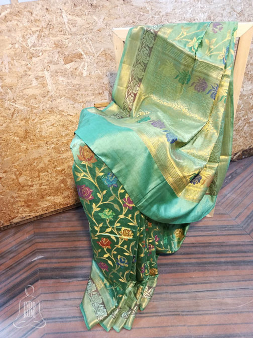 Banarasi Chinia Silk Pastel Green Saree With Orange Green Purple Resham flower motif And Zari Rose Boota Jangla Weave With Meenakari And Heavy Zari Border And Anchal Work