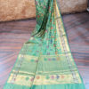 Banarasi Chinia Silk Pastel Green Saree With Orange Green Purple Resham flower motif And Zari Rose Boota Jangla Weave With Meenakari And Heavy Zari Border And Anchal Work