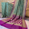Banarasi Khaddi Georgette Pastel Green saree with golden zari lehariya weave heavy border and anchal in Purple base with zari work