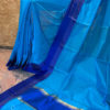 Banarasi Mercerized Cotton light blue plain saree with plain satin lace look border in royal blue golden stripes and royal blue block on anchal