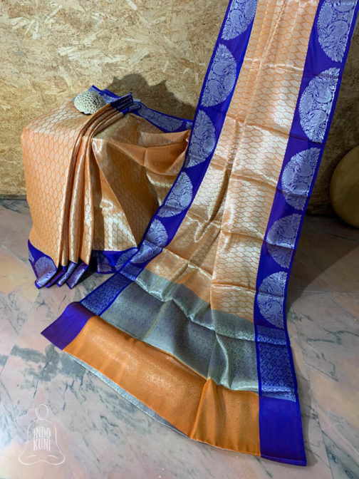 Banarasi Tanchoi Cotton saree with white Resham work on light orange base contrast royal blue border with white resham work and anchal with contrast grey base