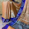 Banarasi Tanchoi Cotton saree with white Resham work on light orange base contrast royal blue border with white resham work and anchal with contrast grey base