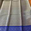 Banarasi Tanchoi Cotton saree with white Resham work on light orange base contrast royal blue border with white resham work and anchal with contrast grey base