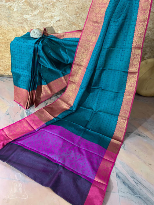 Banarasi Tanchoi Cotton saree with firozi Resham work on dark grey base contrast magenta border with copper zari work and anchal with contrast magenta base