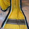 Banarasi Mercerized Cotton Yellow saree with multi-colored stripes and silver zari check weave with black satin and silver zari border and anchal in black base and multicolored stripes and silver zari checks