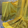 Banarasi Mercerized Cotton Yellow saree with brown resham booti all over and thick border and resham work on anchal