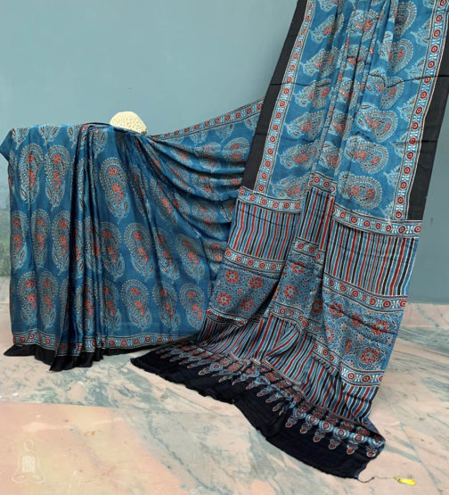 Ajrakh block print indigo modal silk saree with full body floral boota print and thin border on both sides with striped prints and traditional ajrakh block print design on anchal