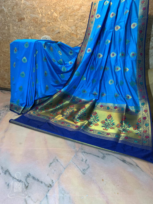 Banarasi Semi Katan silk light blue saree golden zari paisley boota with resham meenakari all over and zari and resham meenakari floral bel boota border and paithni weave anchal with resham meenakari on navy blue base