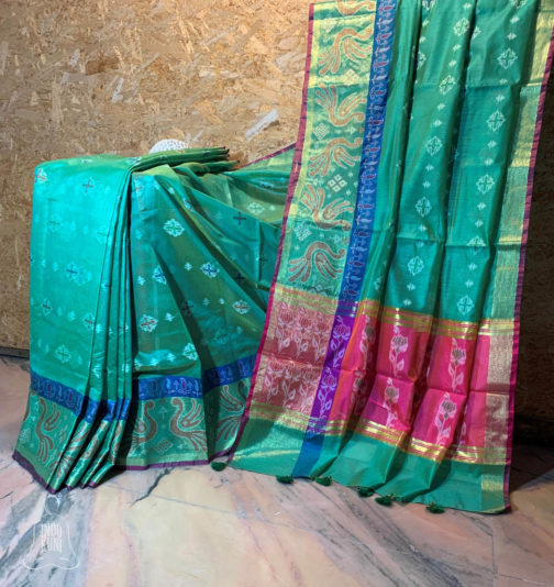 anarasi Silk Cotton Sea green base ikkat weave saree with zari weave mor pattern on border along with dark blue lining and anchal in contrast magenta color