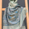 Pure Pashmina stole light sea green color with self woven elephant figure and elephant figure on border woven in blue and mustard color