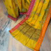 Banarasi Mercerised Cotton Silk saree Turmeric Yellow color with floral antique zari and resham boota on body and resham patta border